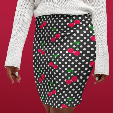 Black polka dot skirt with red cherry pattern worn by a person on a red background