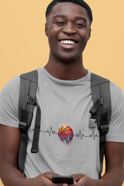 Man wearing a gray t-shirt with a colorful design and a black backpack on a yellow background