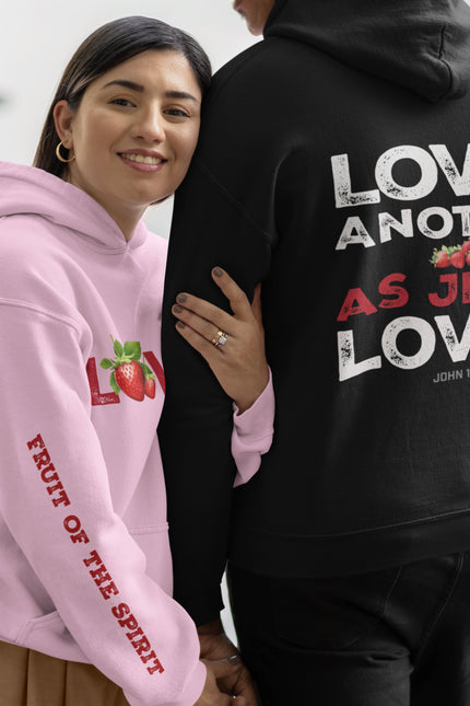 Two people wearing hoodies with motivational text, one pink and one black.
