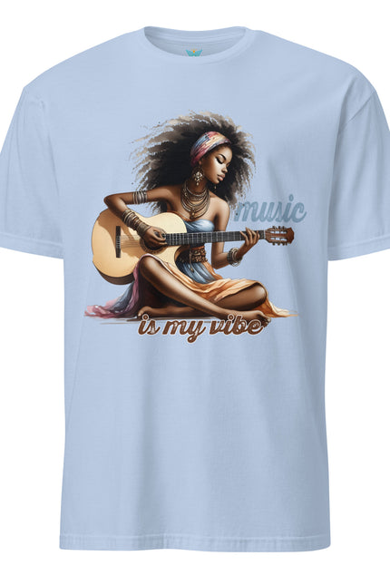 Light blue t-shirt with a graphic of a woman playing guitar and 'music is my vibe' text on a white background.